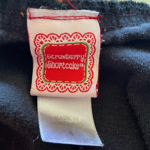 Black Strawberry Shortcake Short Shorts with Red Trim and Rainbow Band in Size 4 - Picture 5 of 6
